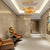 Gold-finished, ornate chandelier with intricate leaf-shaped light fixtures.