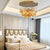 Decorative lighting fixture in a modern home, showcasing gold monstera leaves.

